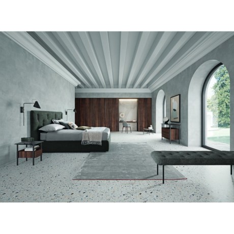 Elegant bedroom scene with a Bars Bed Dallagnese, complemented by a chair and table for a complete look.