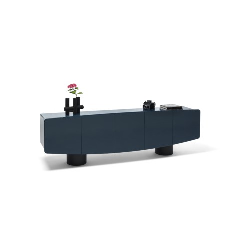 Centrico vase-candlestick, black ceramic, on a modern dark blue sideboard.